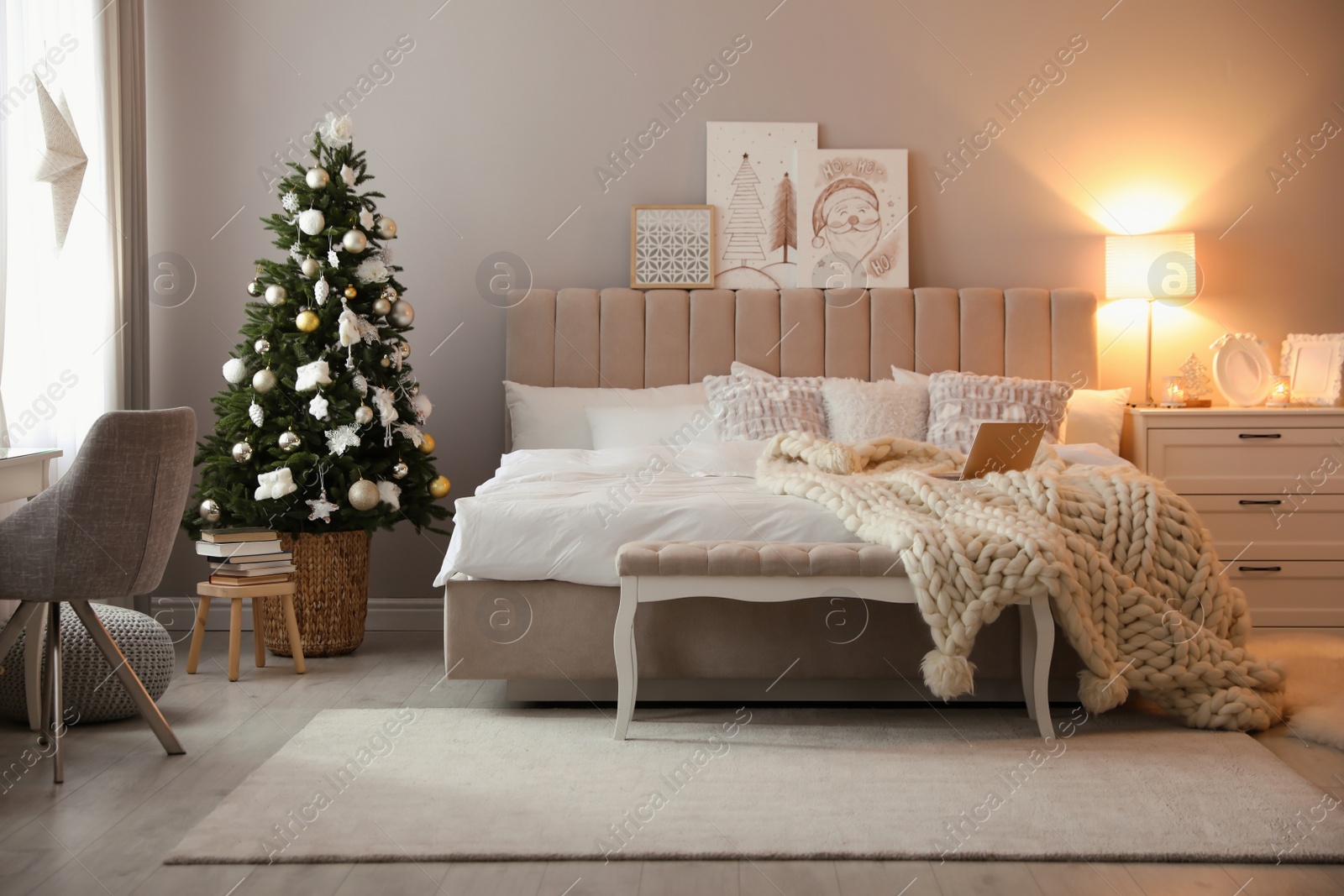 Photo of Beautiful decorated Christmas tree in bedroom interior