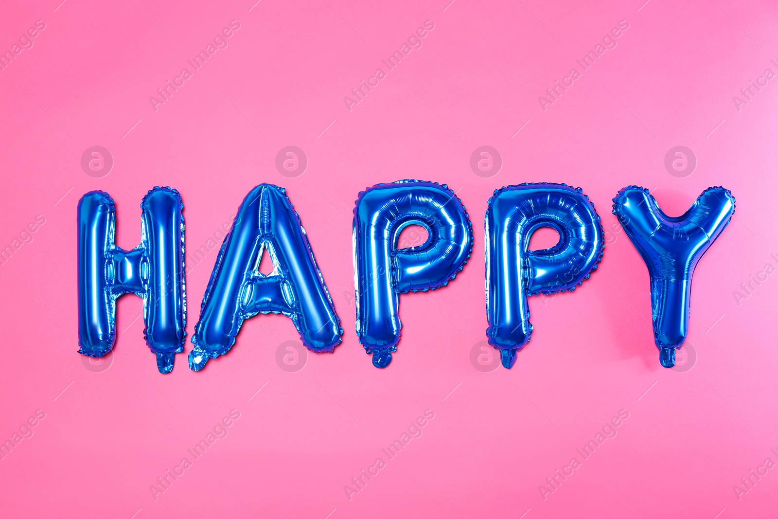 Photo of Word HAPPY made of blue foil balloon letters on pink background