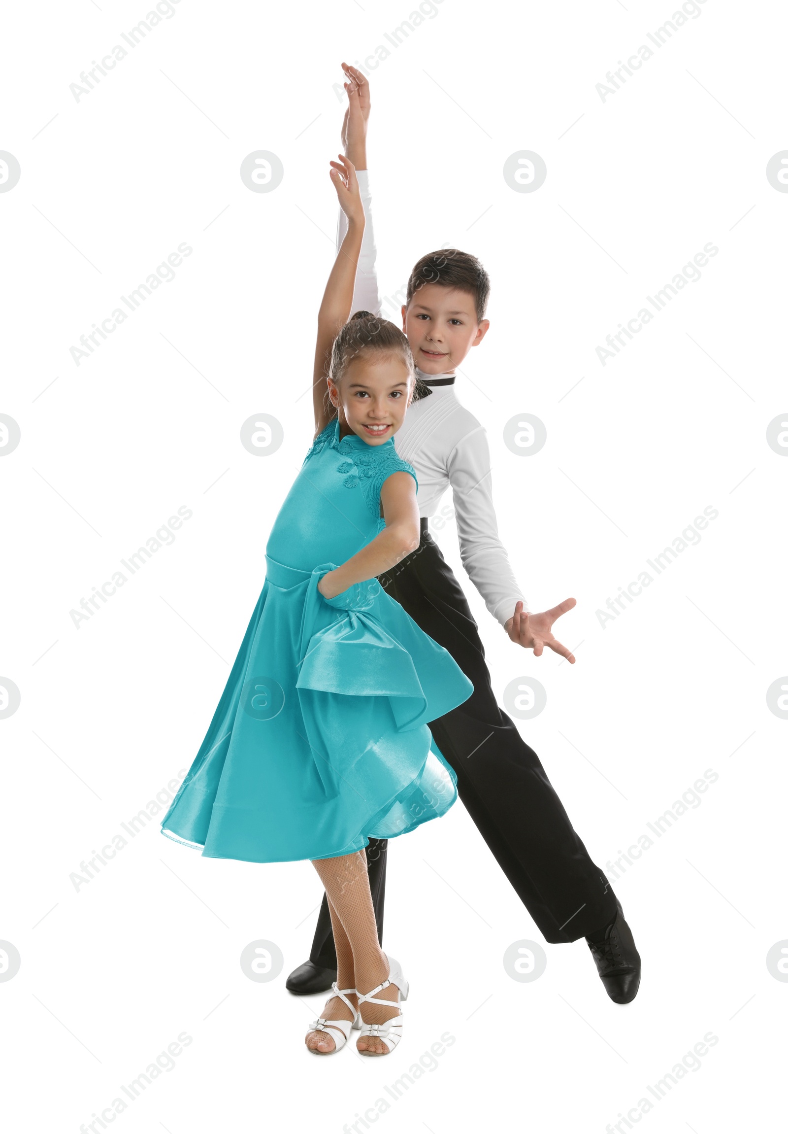 Photo of Beautifully dressed couple of kids dancing on white background