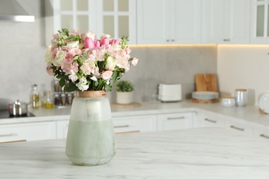 Beautiful bouquet of fresh flowers in vase on table indoors, space for text