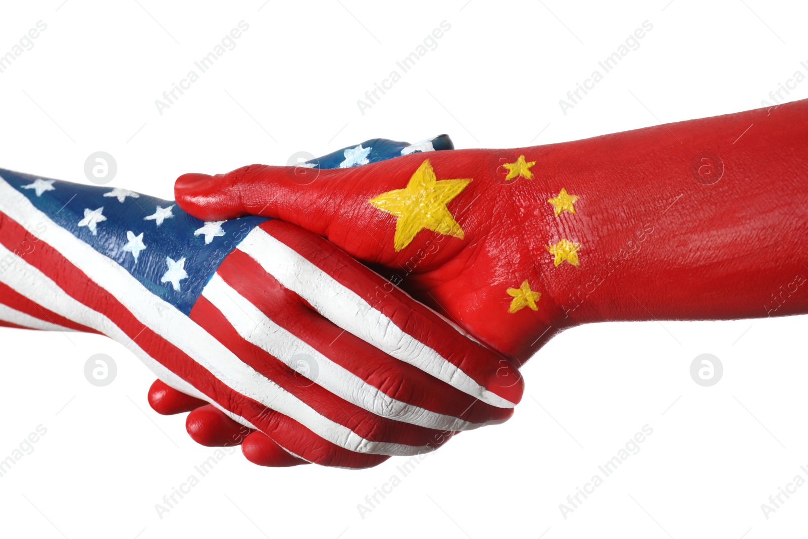Photo of USA and China partnership. People shaking hands painted in flags on white background, closeup