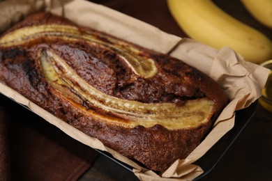 Photo of Delicious banana bread on wooden table, closeup