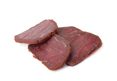 Delicious dry-cured beef basturma slices on white background