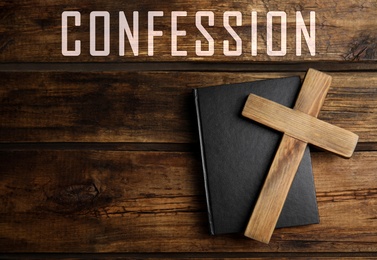 Christian cross, Bible and word Confession on wooden background, top view