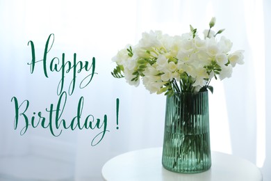 Image of Happy Birthday! Beautiful bouquet with fresh freesia flowers on table indoors
