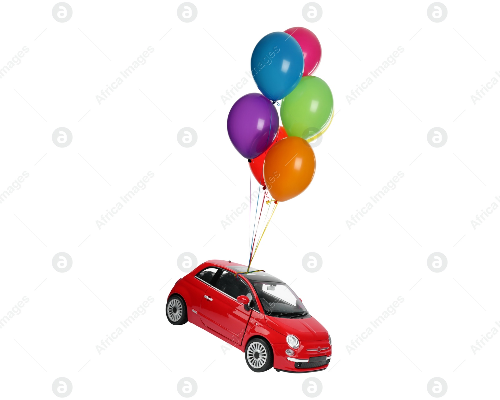 Image of Many balloons tied to toy car flying on white background