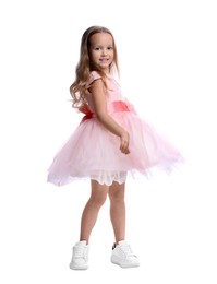 Photo of Cute little girl in beautiful dress dancing on white background