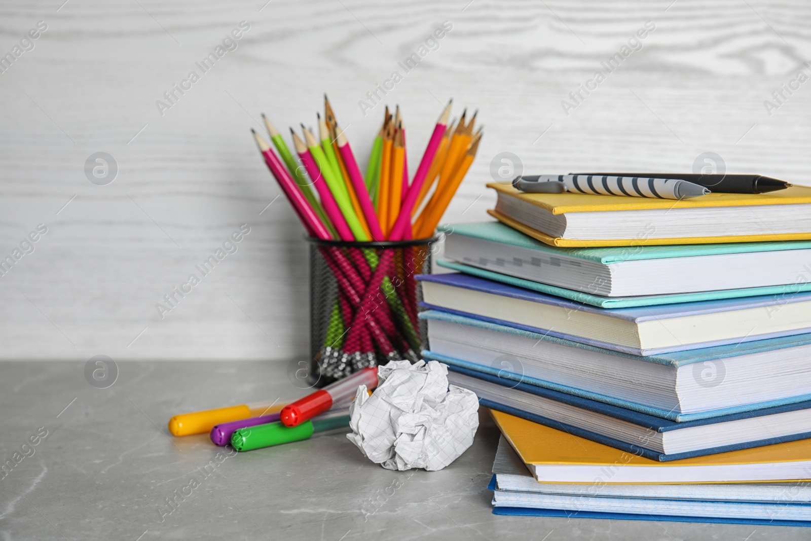 Photo of Different school stationery on table against light background