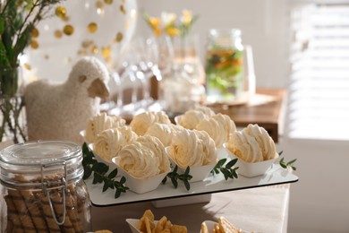 Tasty treats on table in room. Baby shower party