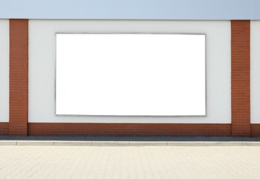 Image of Empty signboard on wall outdoors. Mock-up for design