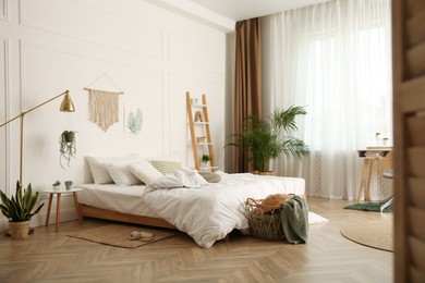 Photo of Modern bedroom with beautiful fresh house plants