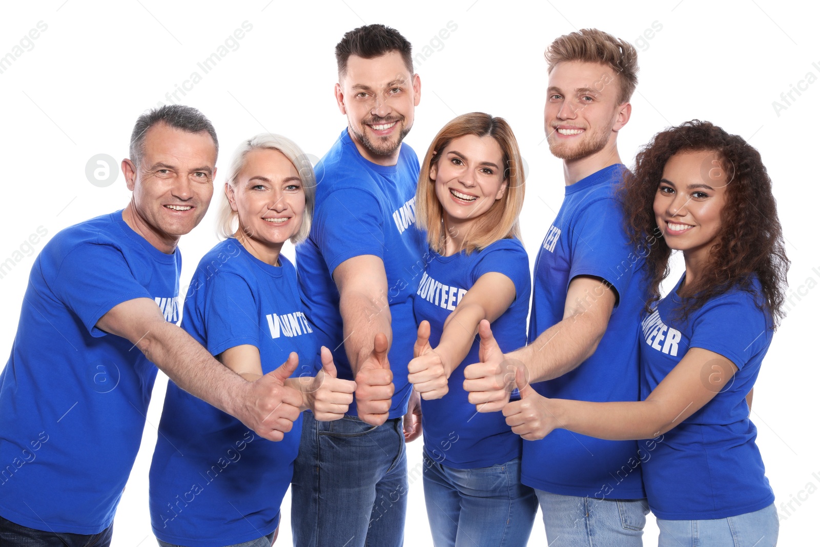 Photo of Team of volunteers in uniform showing thumbs up on white background