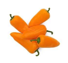 Fresh raw orange hot chili peppers on white background, top view