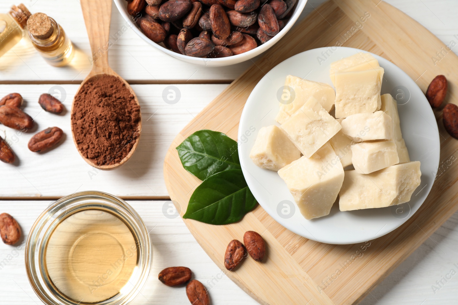 Photo of Flat lay composition with organic cocoa butter on white wooden table