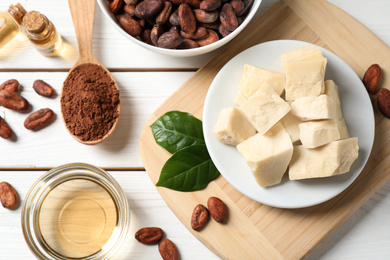 Photo of Flat lay composition with organic cocoa butter on white wooden table