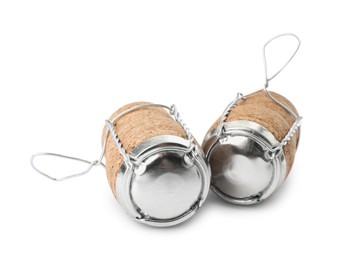 Sparkling wine corks with muselet caps on white background