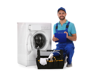 Photo of Repairman with clipboard and toolbox near washing machine on white background