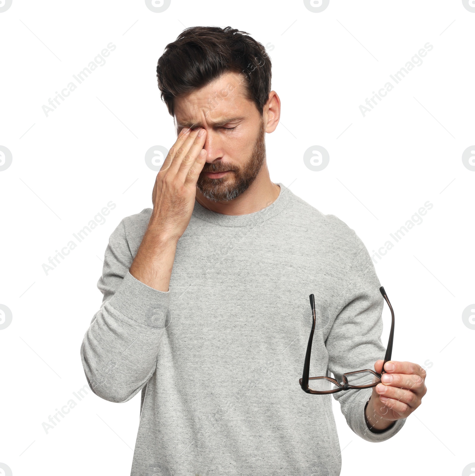 Photo of Man suffering from eyestrain on white background