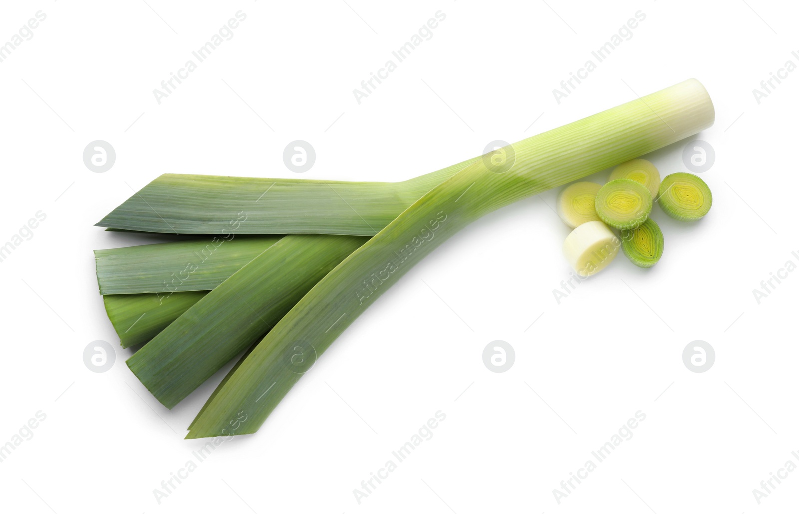 Photo of Whole and cut fresh leeks on white background, top view