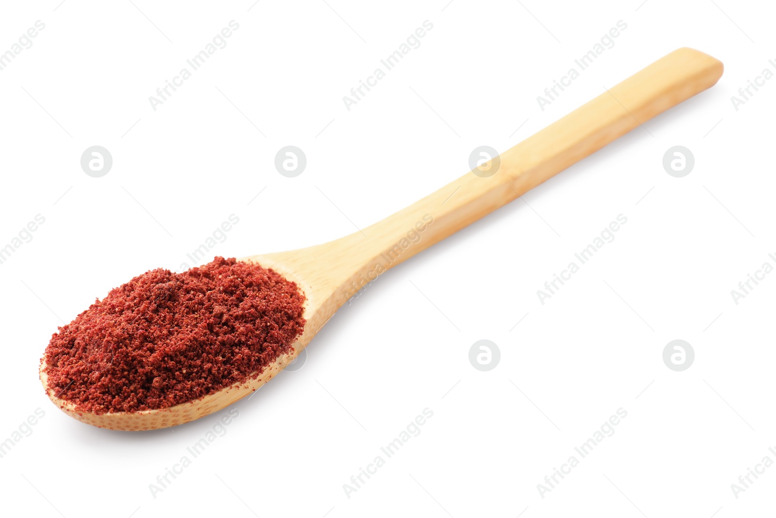 Photo of Dried cranberry powder in spoon isolated on white