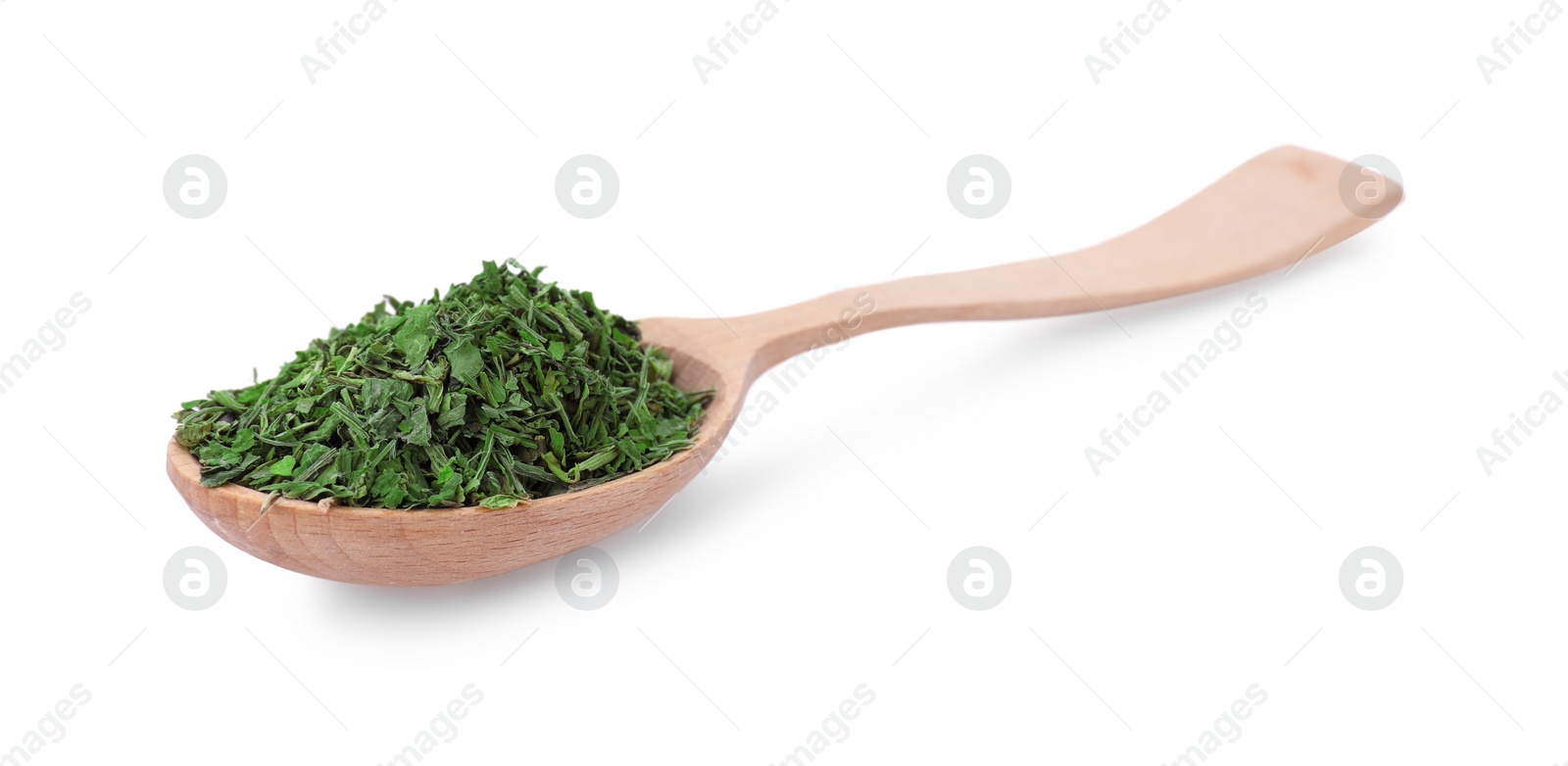 Photo of Wooden spoon of dried parsley isolated on white