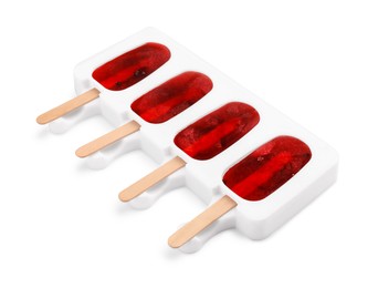 Photo of Tasty ice pops in mold isolated on white. Fruit popsicle