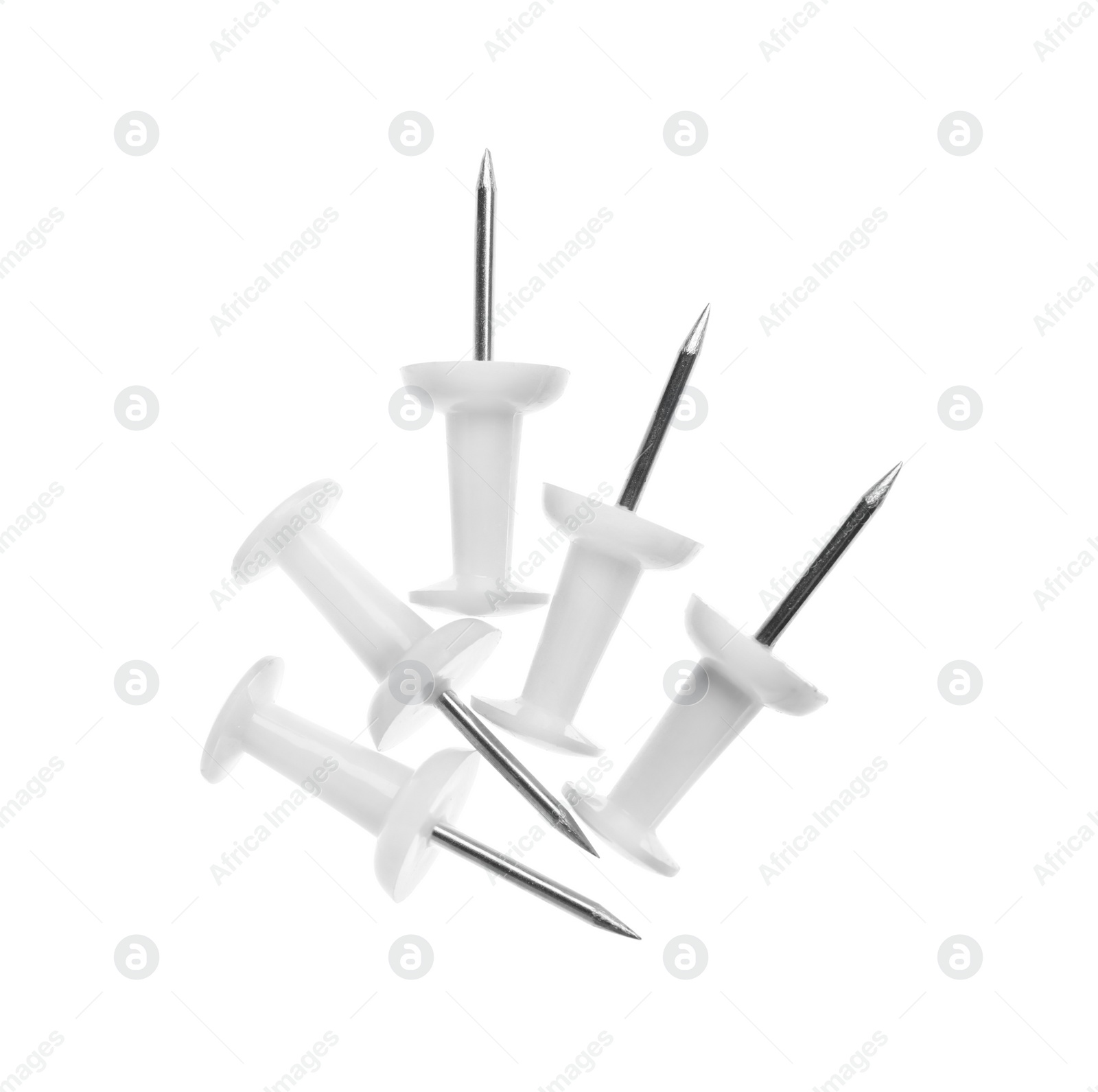 Photo of Colorful drawing pins isolated on white, top view. School stationery