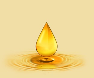 Image of Drop of cooking oil falling into oil on beige background