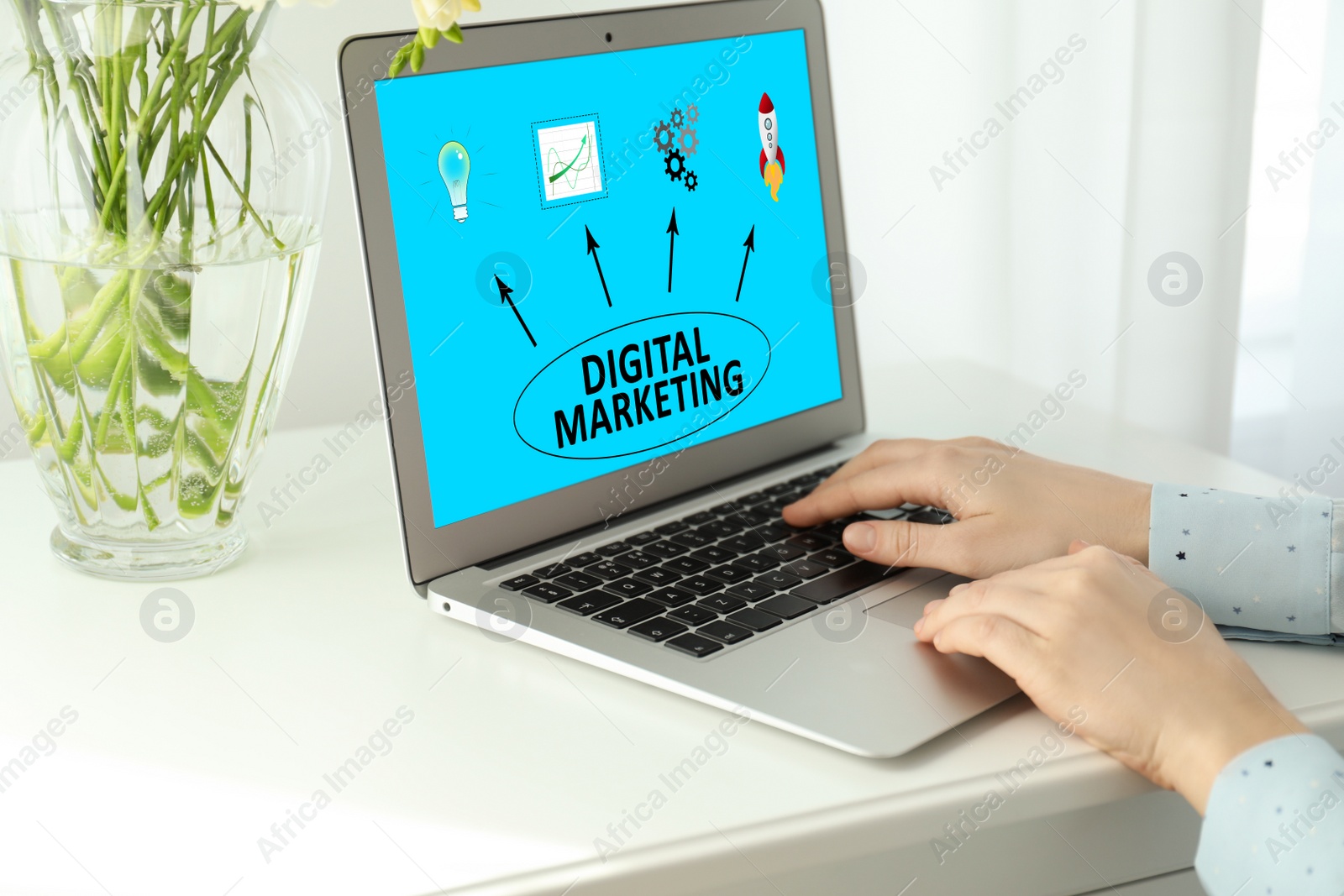 Image of Digital marketing concept. Woman working with laptop at table indoors, closeup