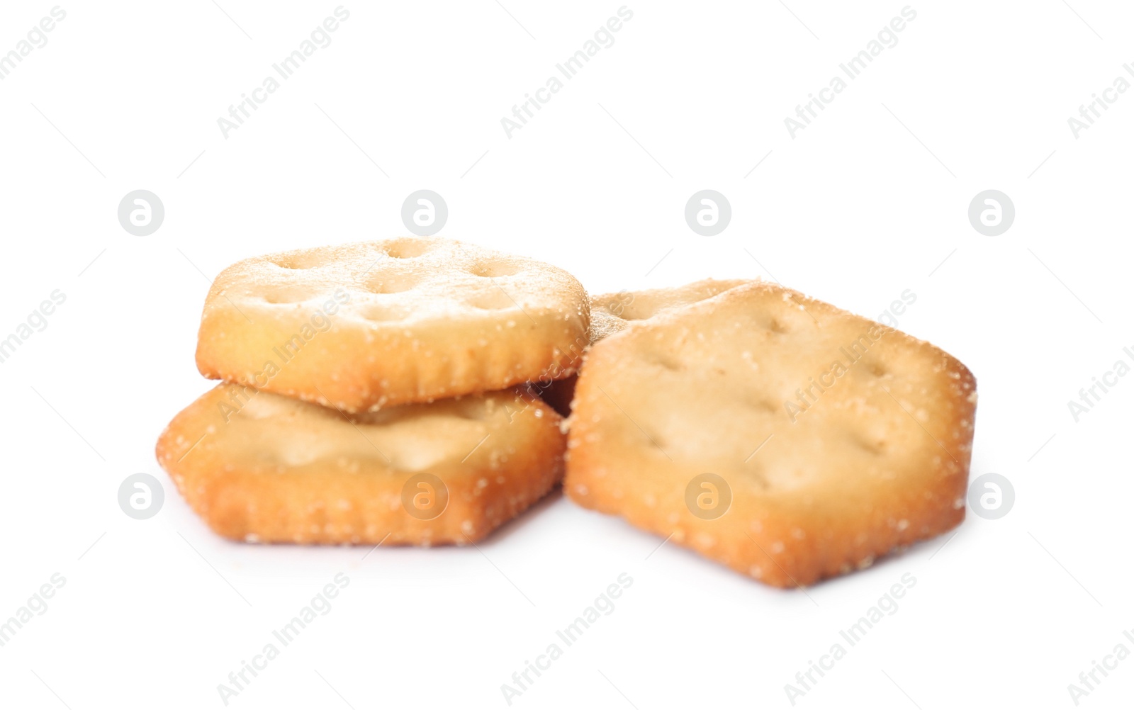 Photo of Crispy crackers isolated on white. Delicious snack