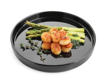 Photo of Delicious fried scallops with asparagus and thyme isolated on white