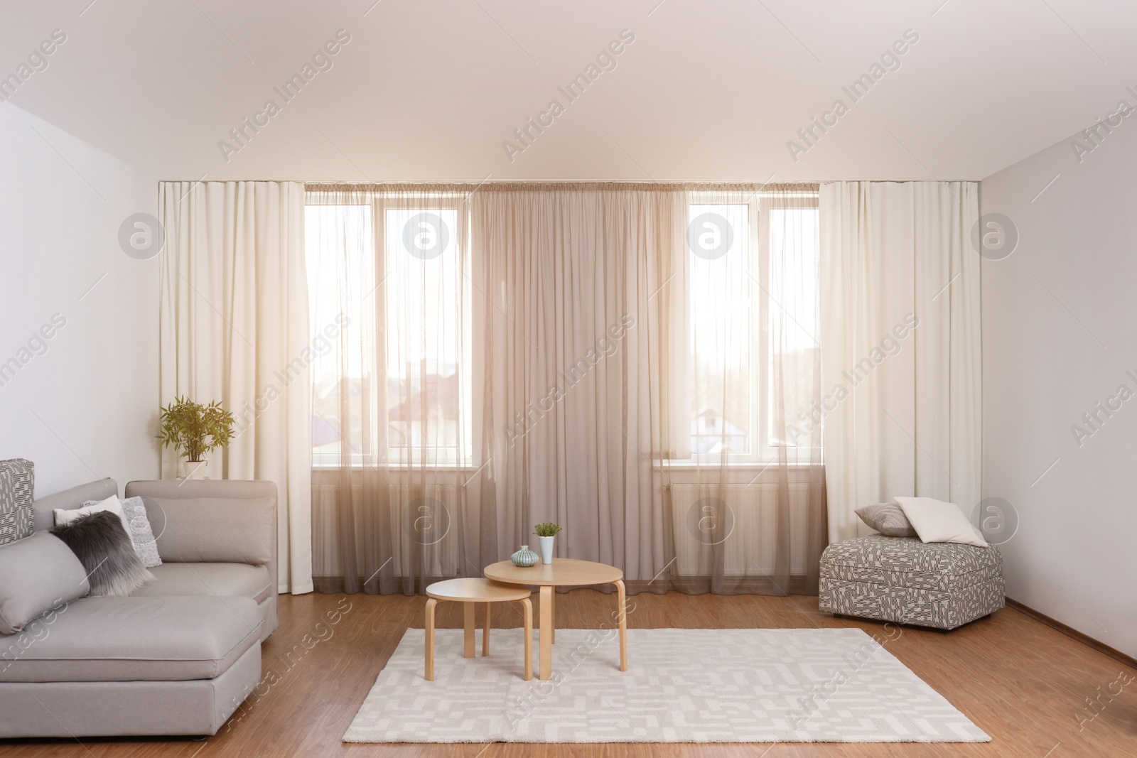 Photo of Windows with stylish curtains in living room interior