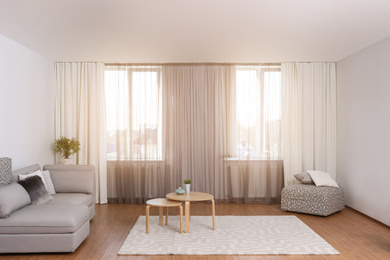 Photo of Windows with stylish curtains in living room interior