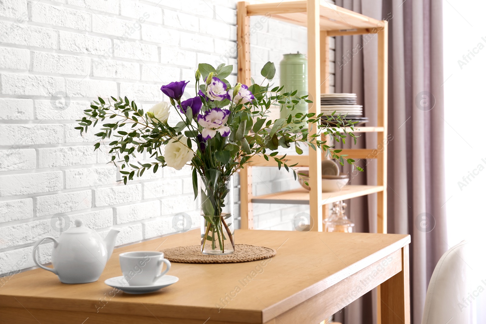 Photo of Stylish room interior with wooden dining table