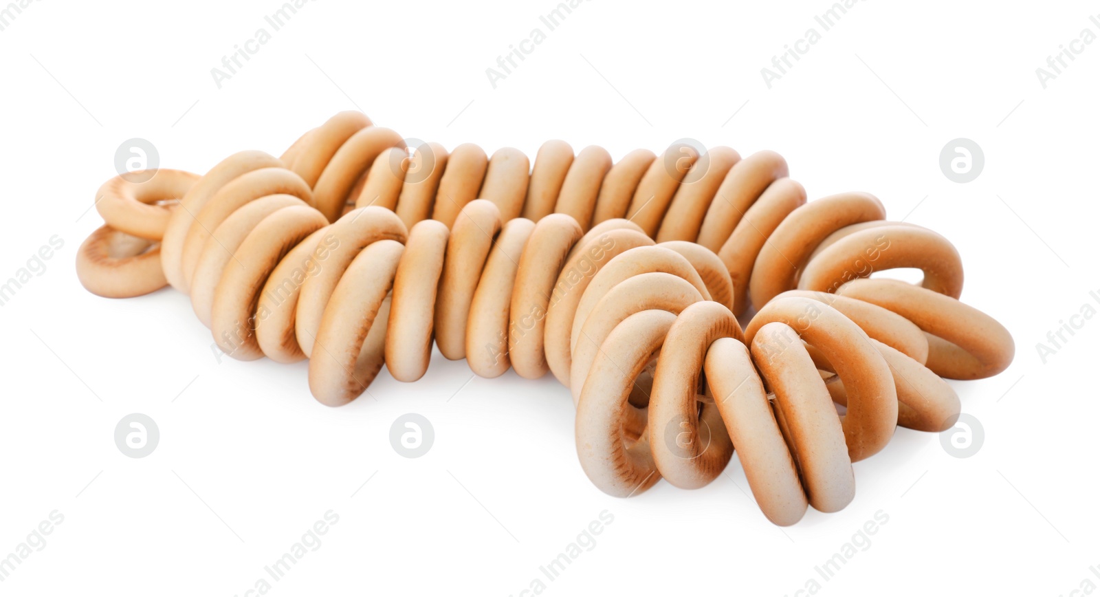 Photo of Bunch of delicious ring shaped Sushki (dry bagels) on white background