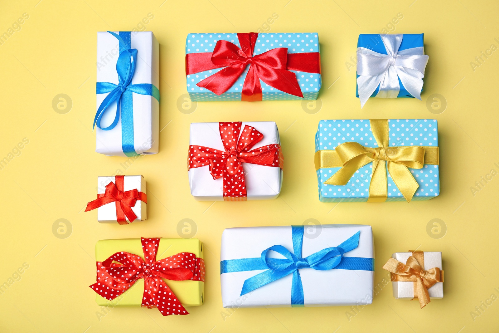 Photo of Flat lay composition with different gift boxes on color background