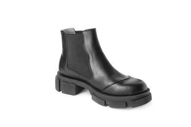 Photo of Stylish leather boot on white background. Trendy footwear