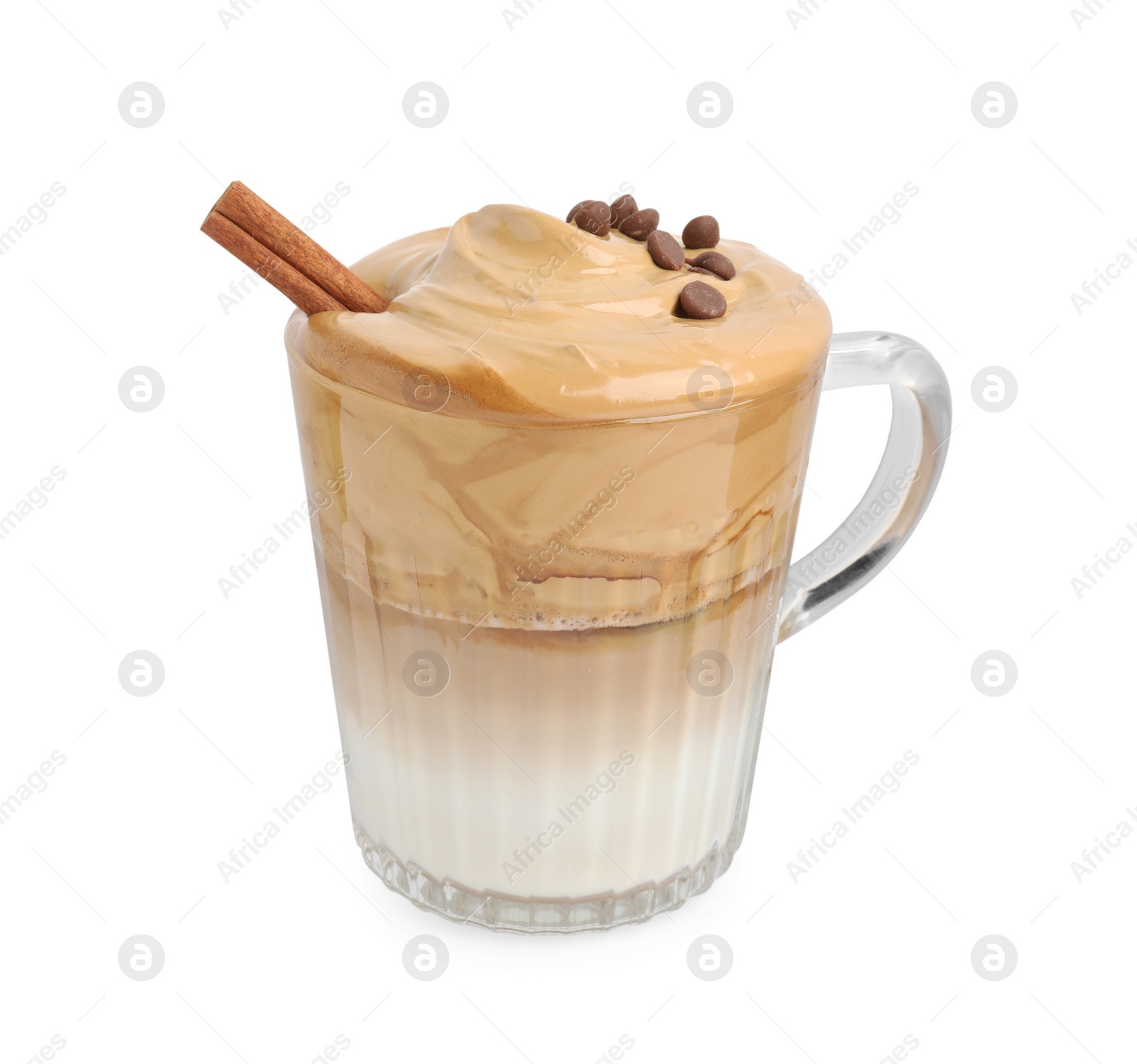 Photo of Glass mug of delicious dalgona coffee with cinnamon stick and chocolate chips isolated on white