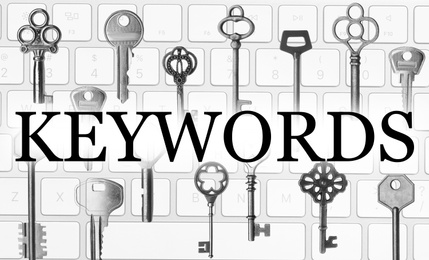 Image of Word Keywords, keys and keyboard. SEO direction