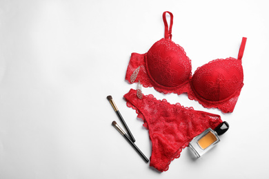 Photo of Composition with elegant women's underwear on light background, flat lay