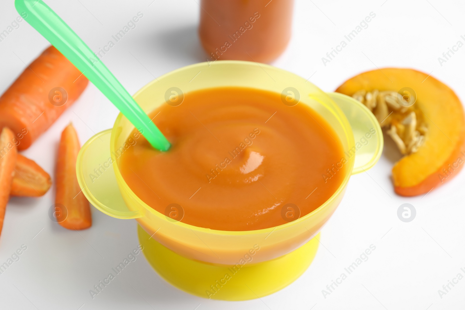 Photo of Healthy baby food and ingredients on white background