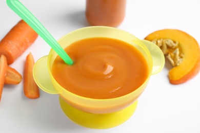 Photo of Healthy baby food and ingredients on white background