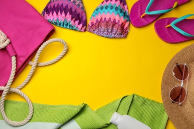 Photo of Flat lay composition with beach accessories on color background. Space for text