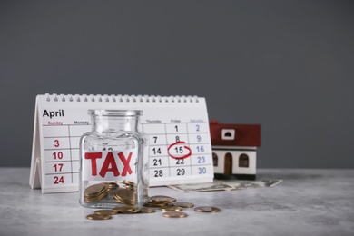 Photo of Composition with money and calendar on table. Tax time