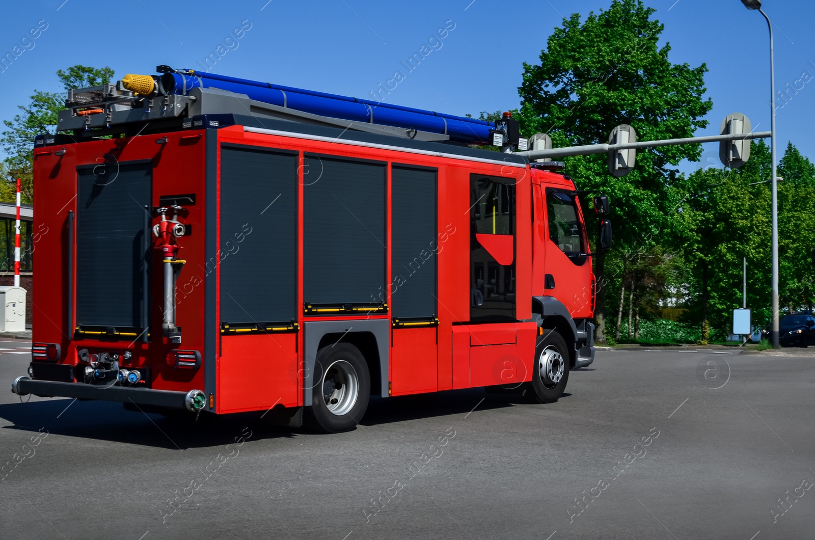 Photo of Modern red fire truck on city street