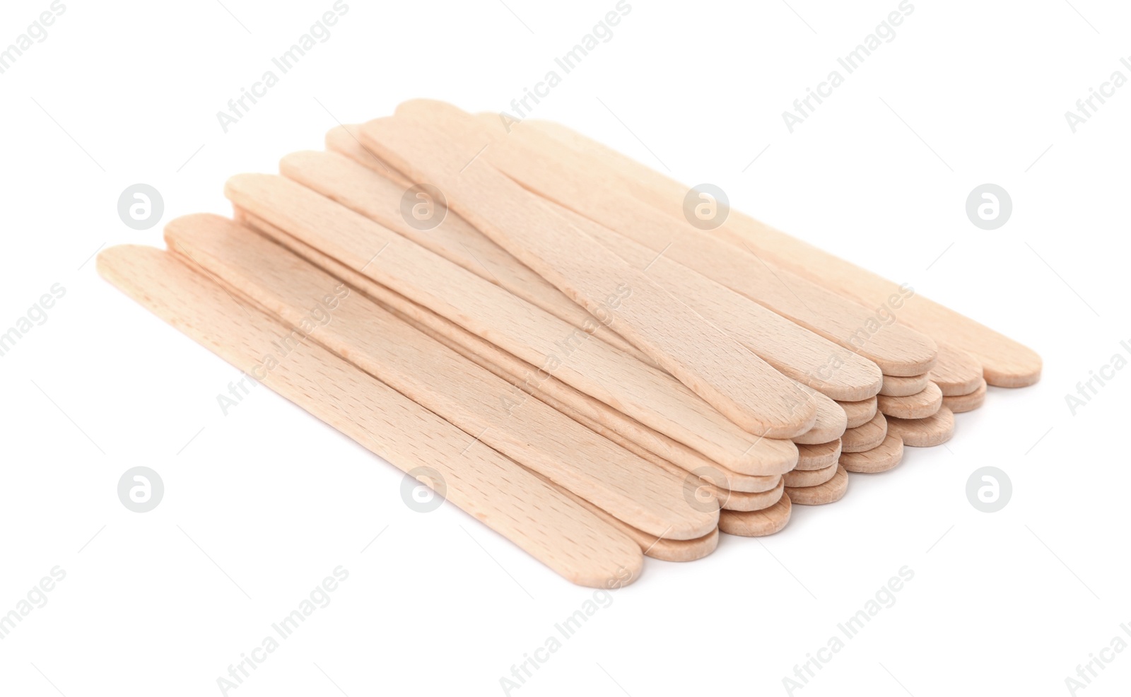 Photo of Disposable wooden spatulas for depilatory wax on white background