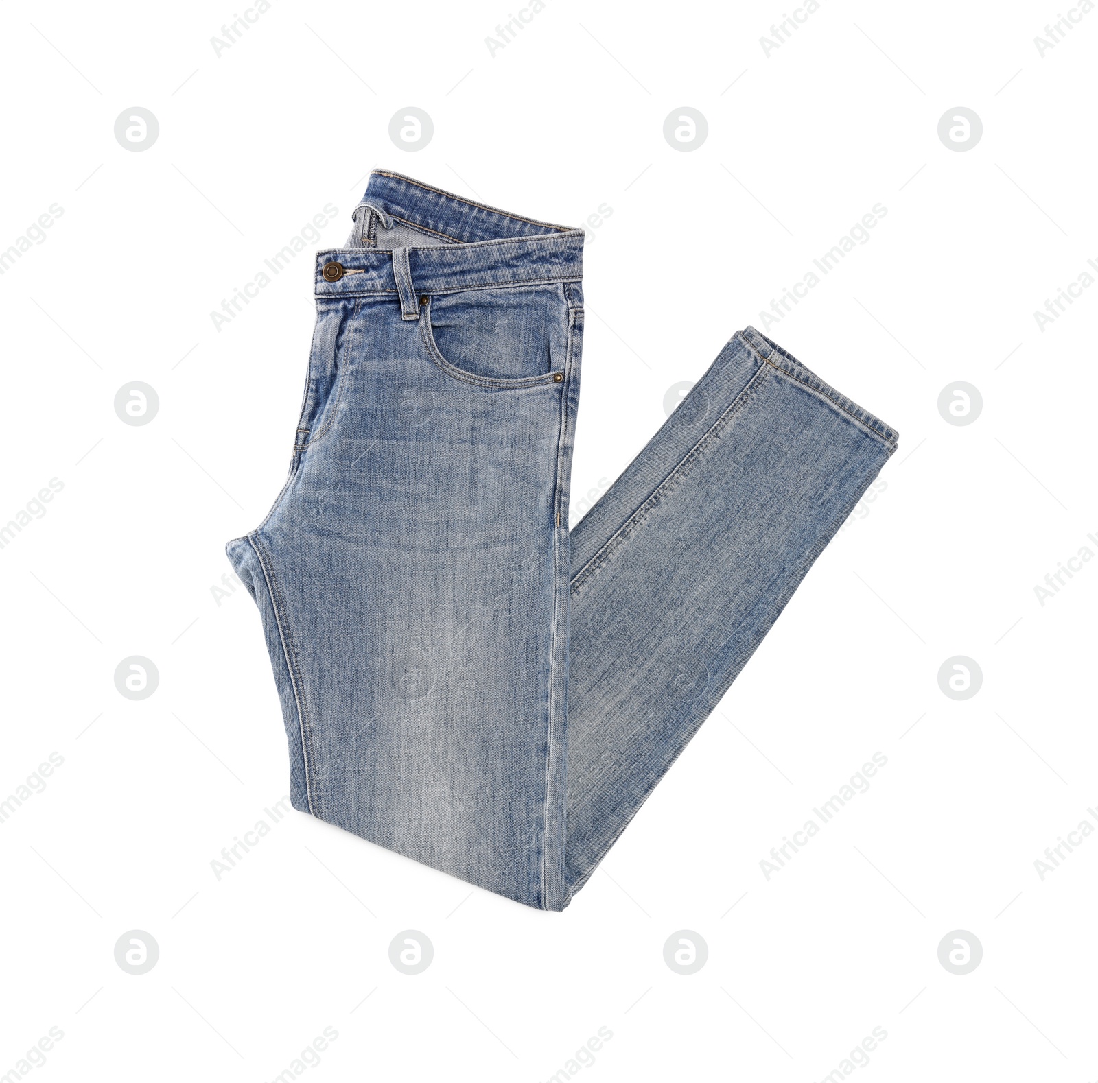 Photo of Stylish light blue jeans isolated on white, top view