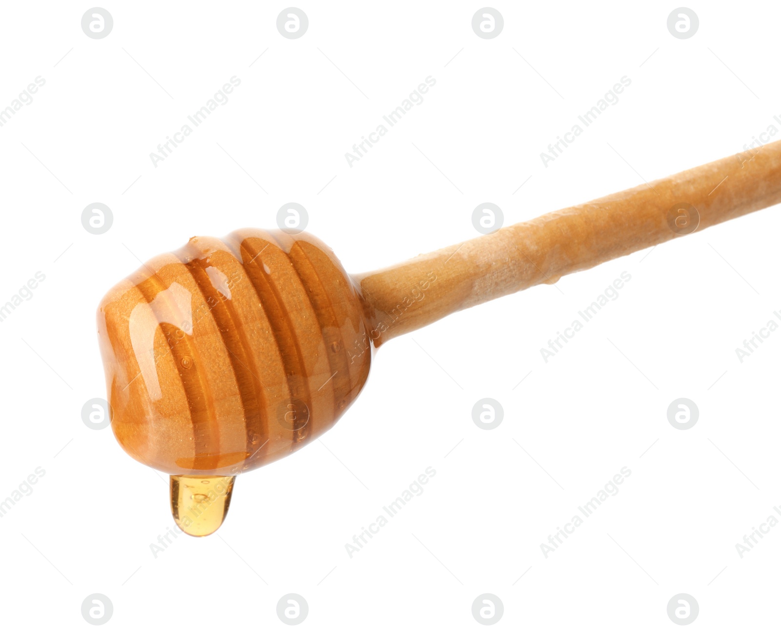 Photo of Honey dripping from dipper on white background