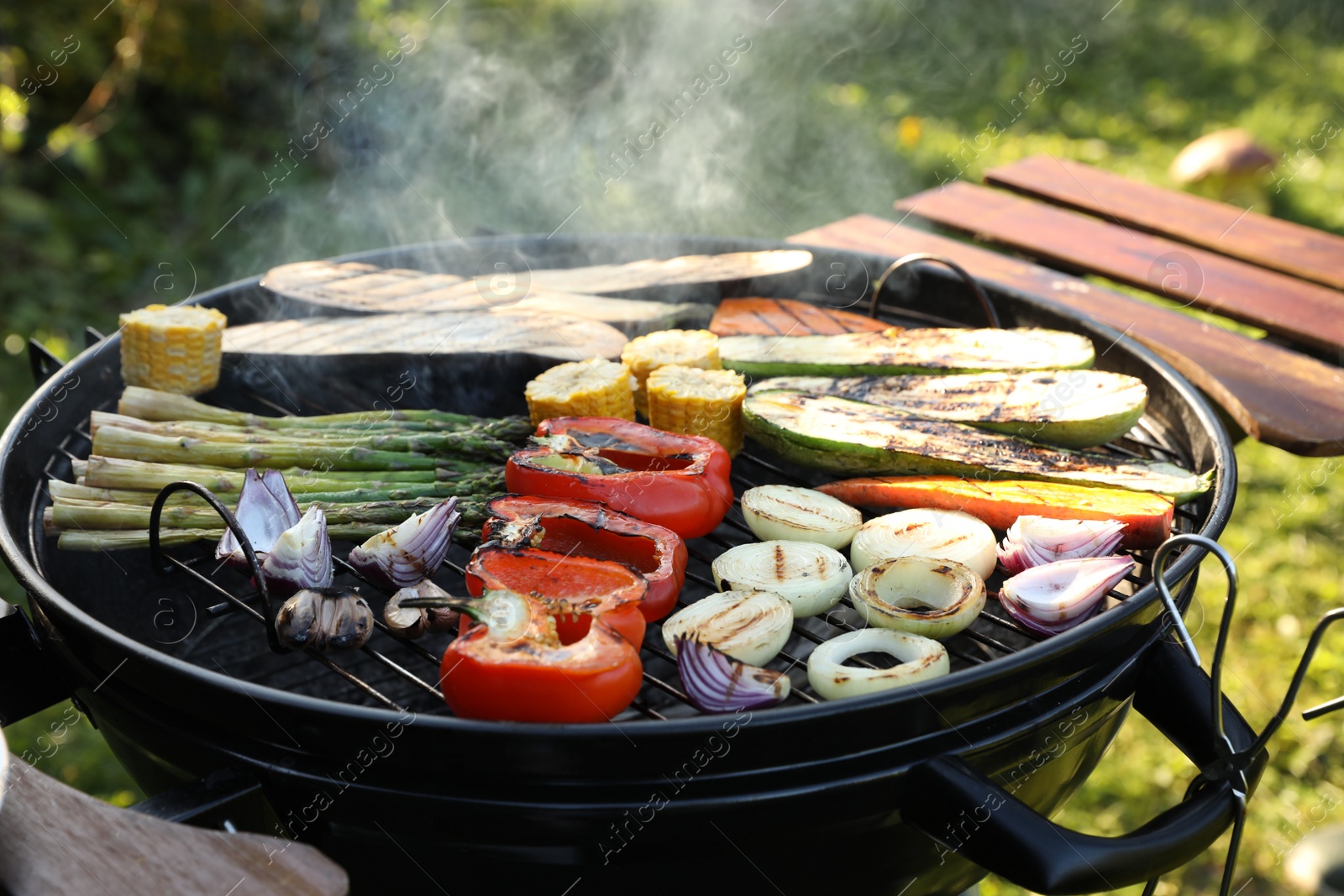 Photo of Delicious grilled vegetables on barbecue grill outdoors