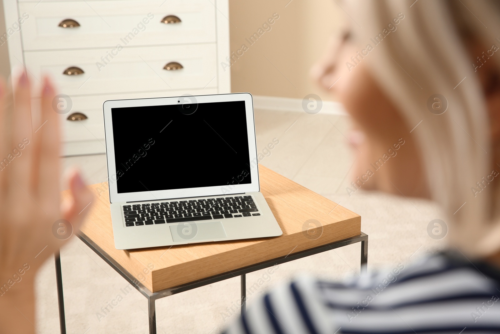 Photo of Woman using video chat on laptop at home, closeup. Space for text